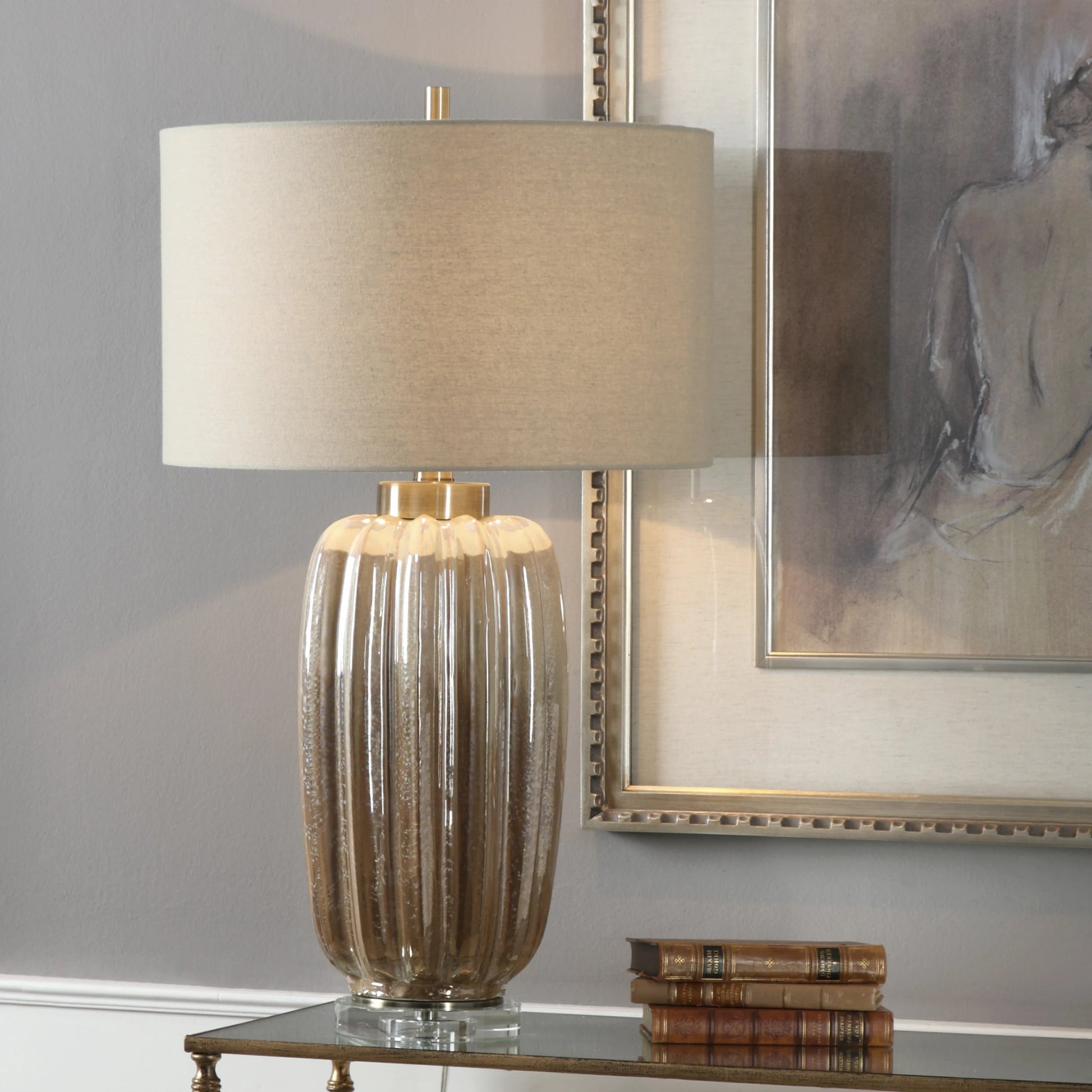 Gistova Table Lamp by Uttermost in gold. Made from steel, ceramic, crystal in a modern style.