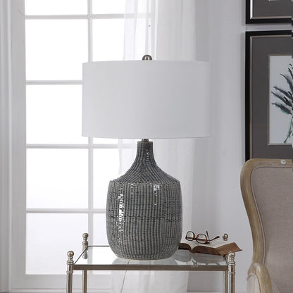 Felipe Table Lamp by Uttermost in light gray. Made from ceramic, iron, fabric in a eclectic & global style.