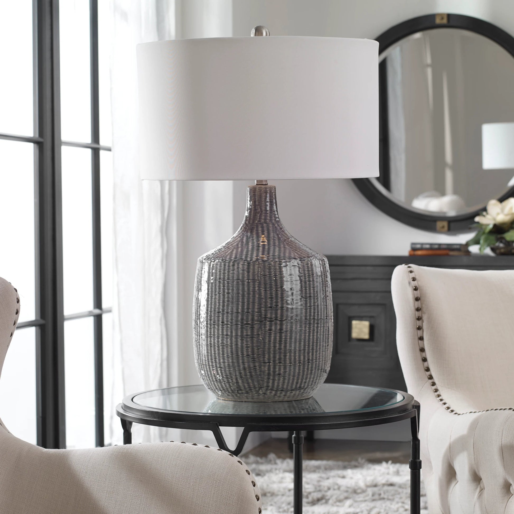 Felipe Table Lamp by Uttermost in light gray. Made from ceramic, iron, fabric in a eclectic & global style.