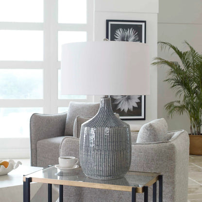 Felipe Table Lamp by Uttermost in light gray. Made from ceramic, iron, fabric in a eclectic & global style.