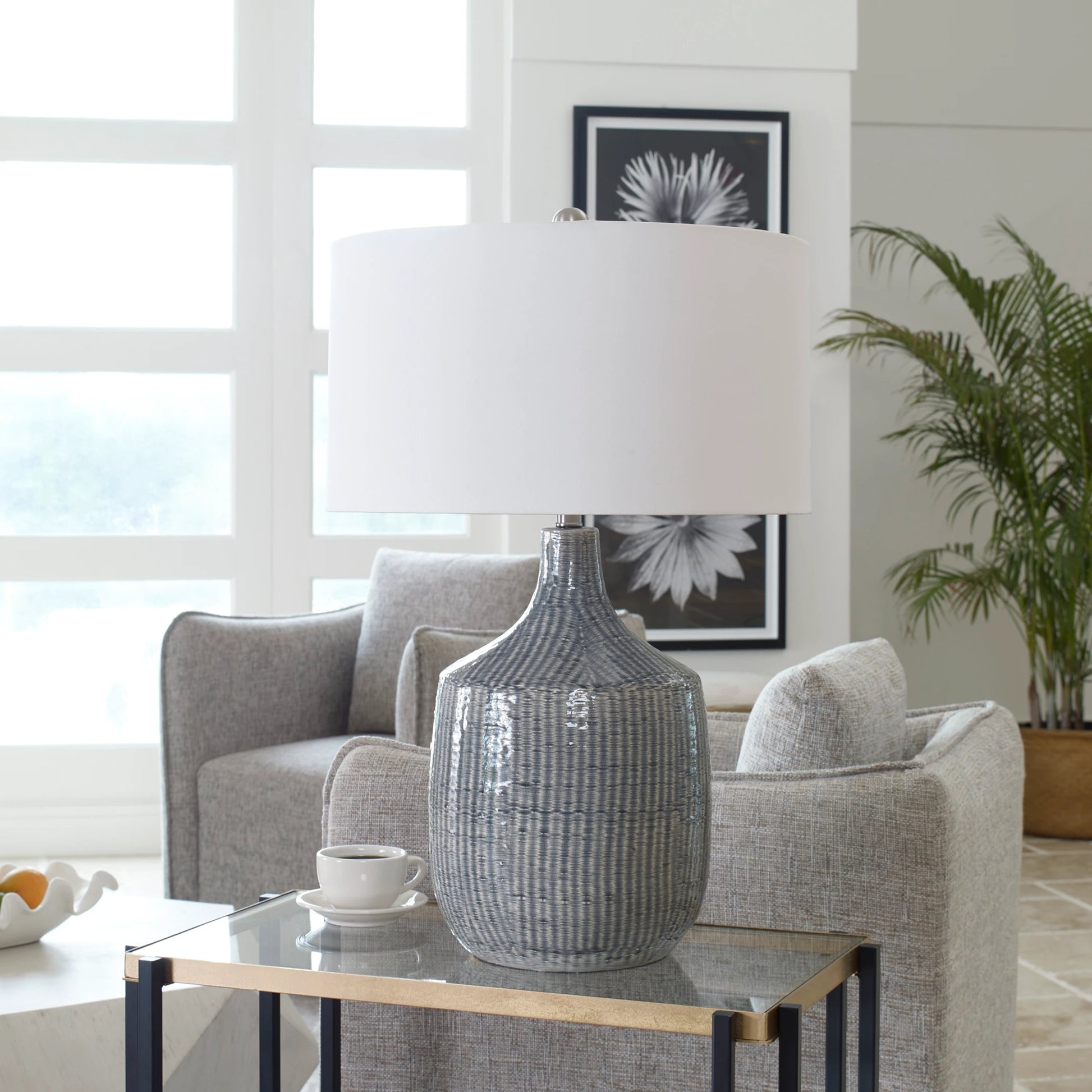 Felipe Table Lamp by Uttermost in light gray. Made from ceramic, iron, fabric in a eclectic & global style.