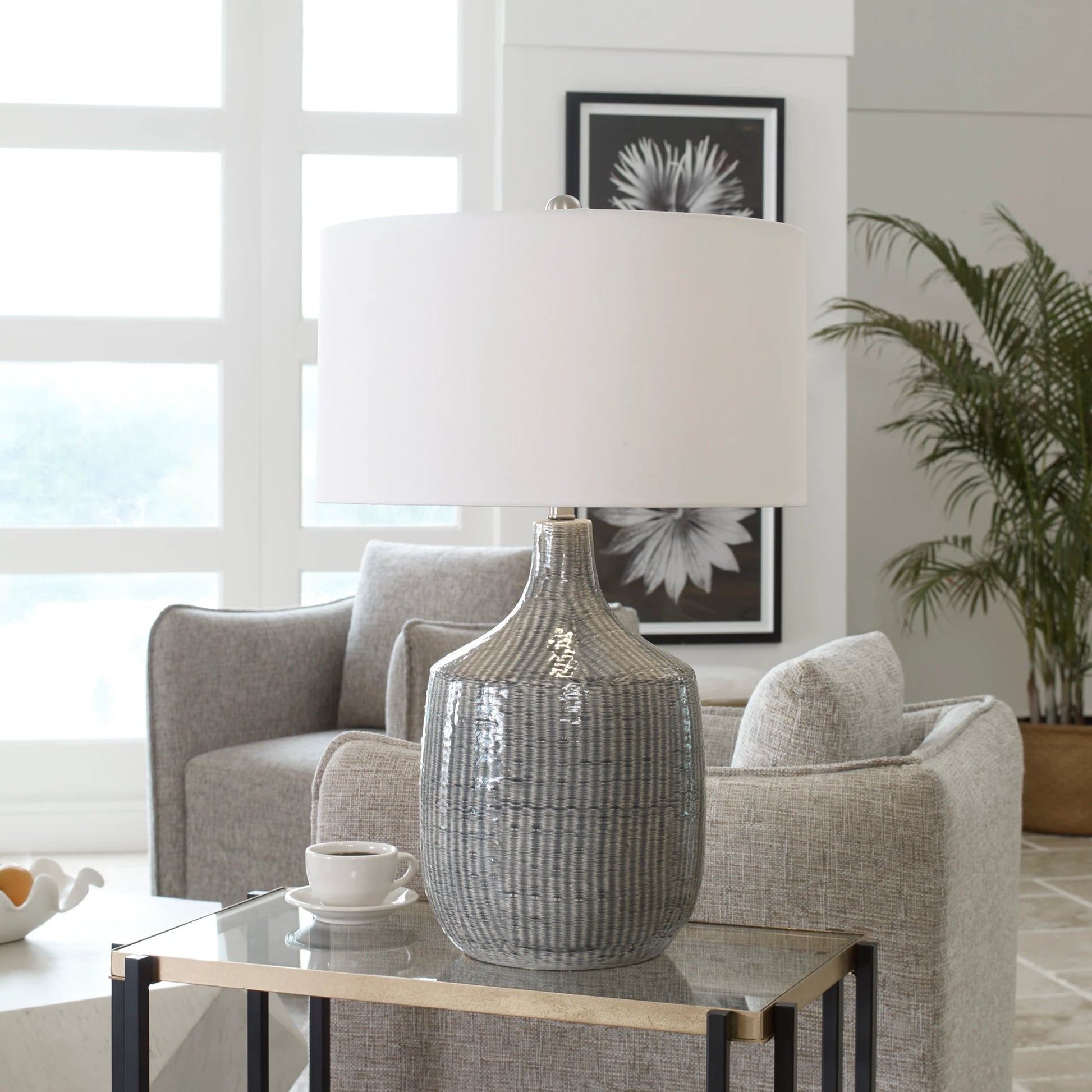 Felipe Table Lamp by Uttermost in light gray. Made from ceramic, iron, fabric in a eclectic & global style.