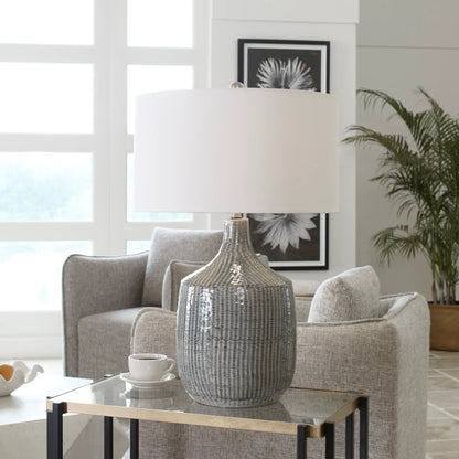 Felipe Table Lamp by Uttermost in light gray. Made from ceramic, iron, fabric in a eclectic & global style.
