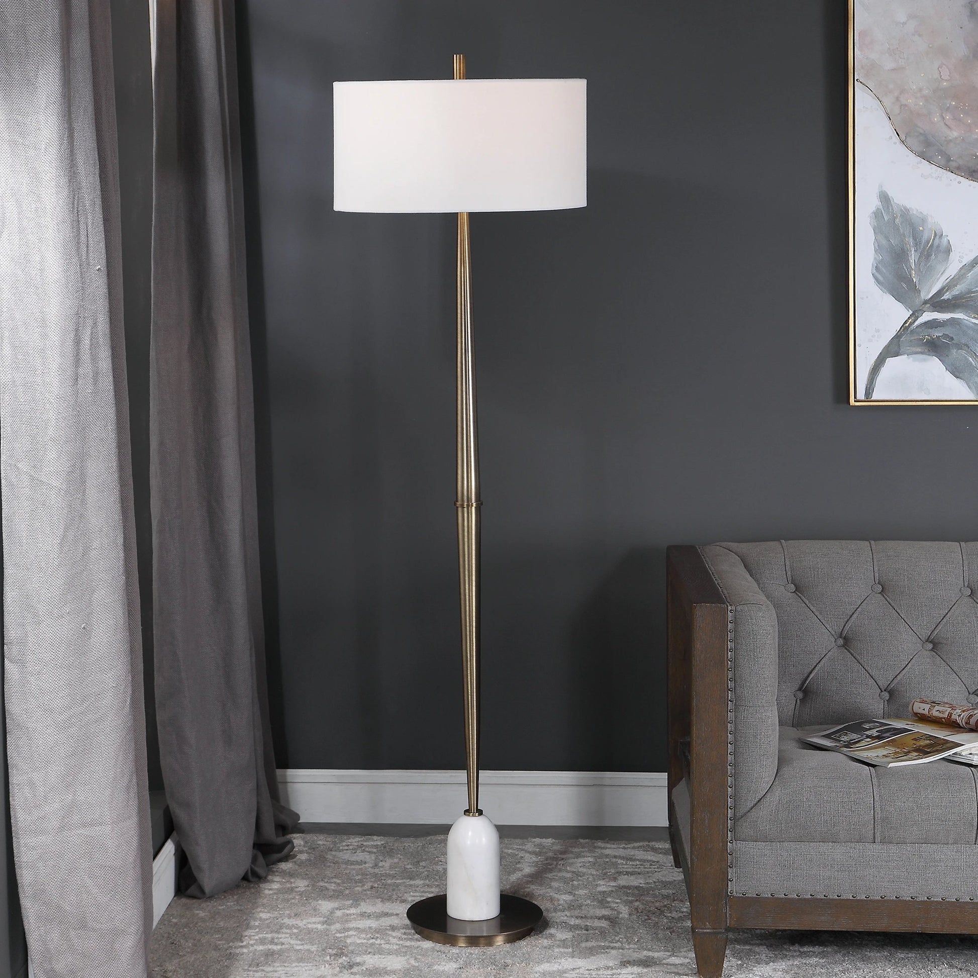 Minette Floor Lamp by Uttermost in antique brass. Made from steel, marble, fabric in a modern style.
