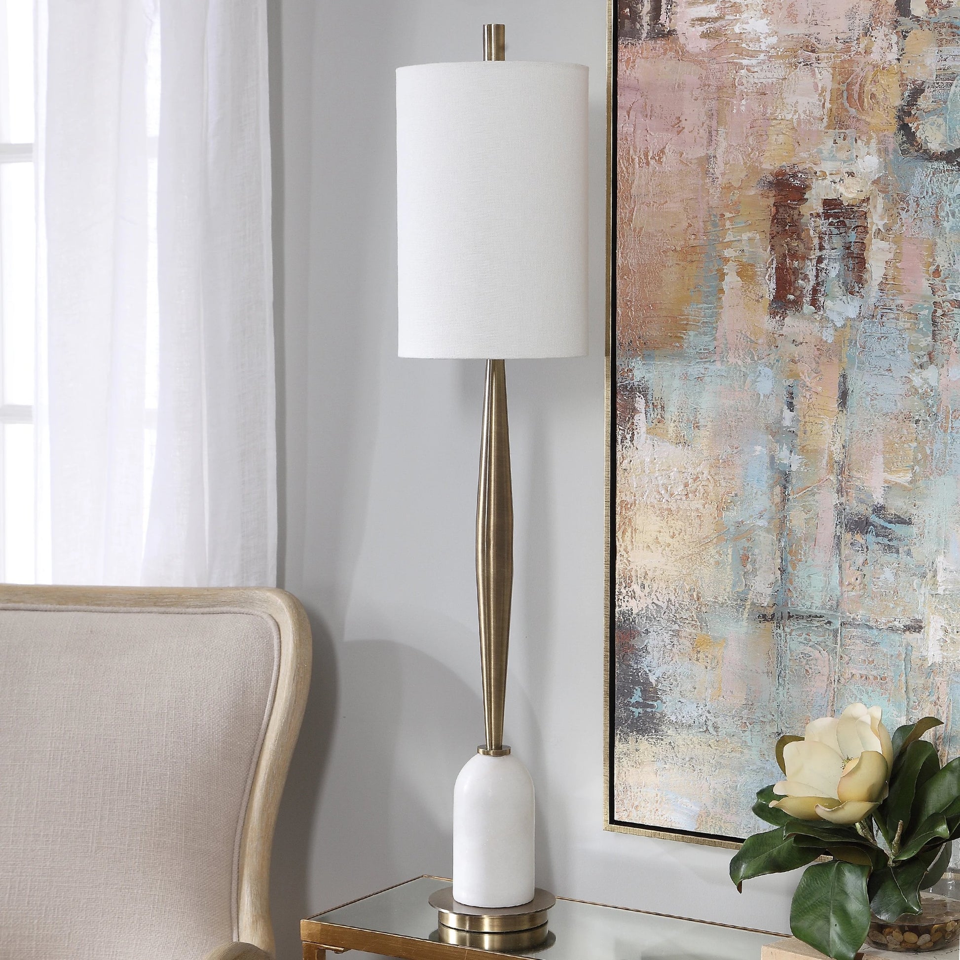 Minette Buffet Lamp by Uttermost in antique brass. Made from steel, marble, fabric in a modern style.