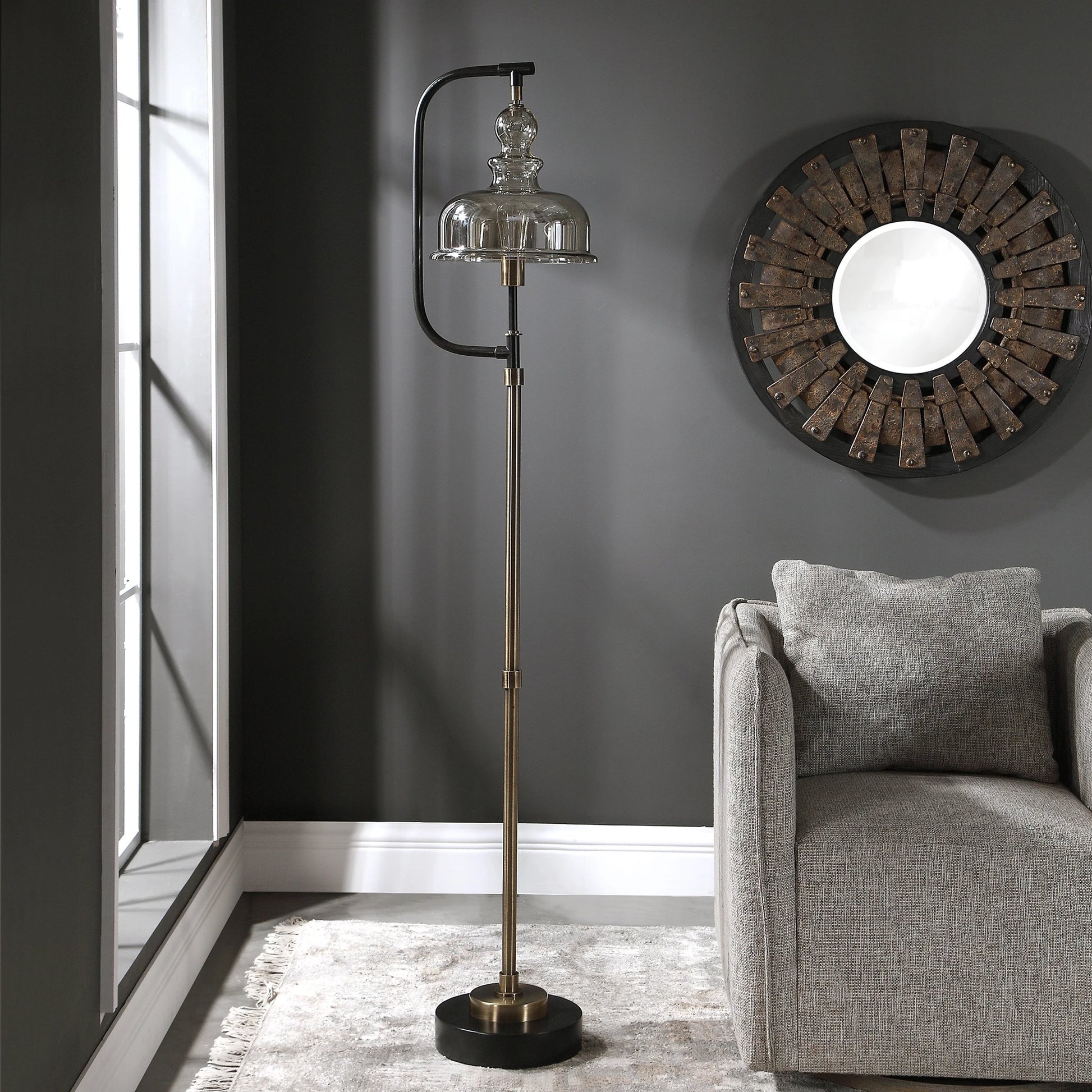 Elieser Floor Lamp by Uttermost in antique brass. Made from steel, glass in a modern style.