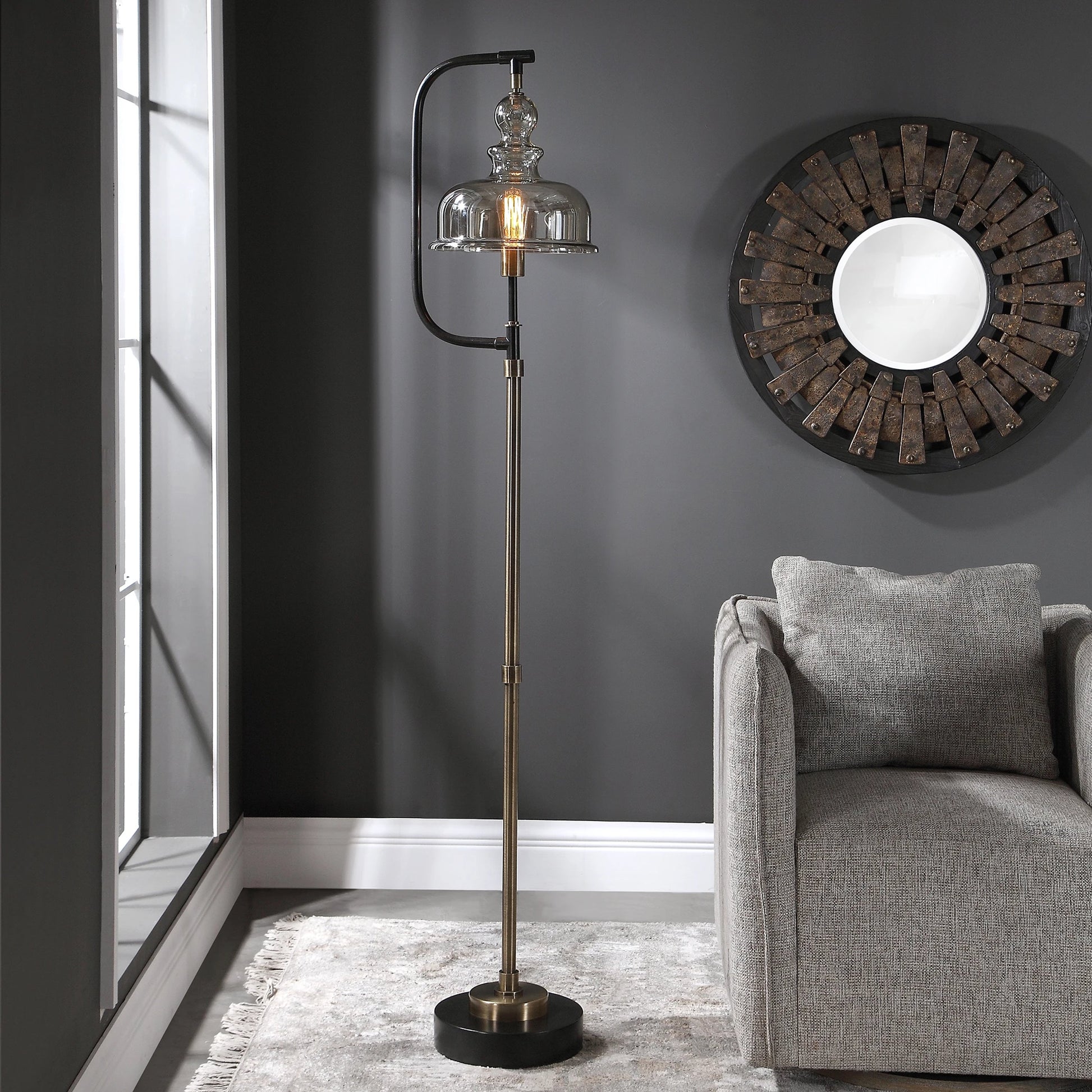 Elieser Floor Lamp by Uttermost in antique brass. Made from steel, glass in a modern style.