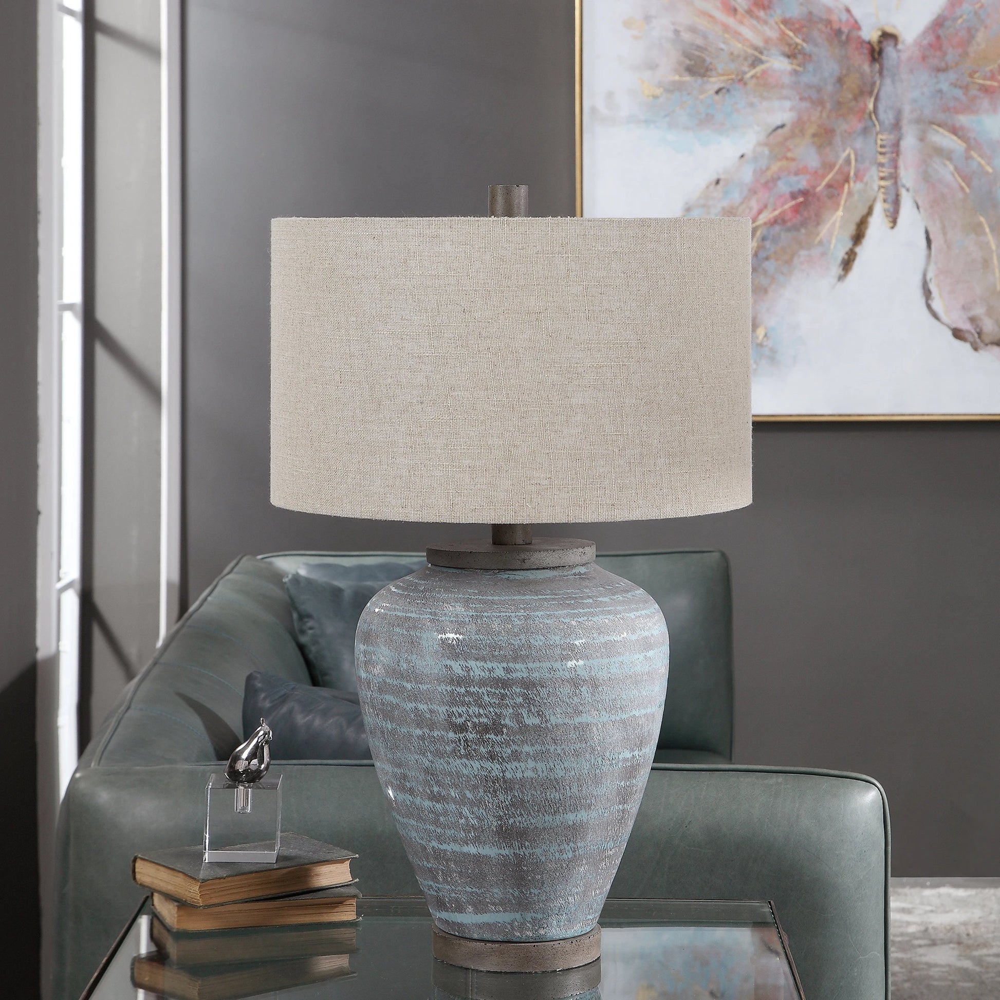 Pelia Table Lamp by Uttermost in aqua. Made from ceramic, resin, fabric in a coastal style.