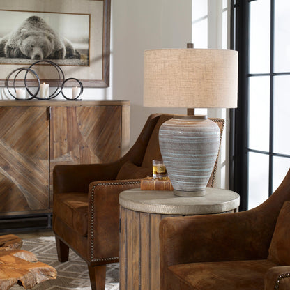 Pelia Table Lamp by Uttermost in aqua. Made from ceramic, resin, fabric in a coastal style.