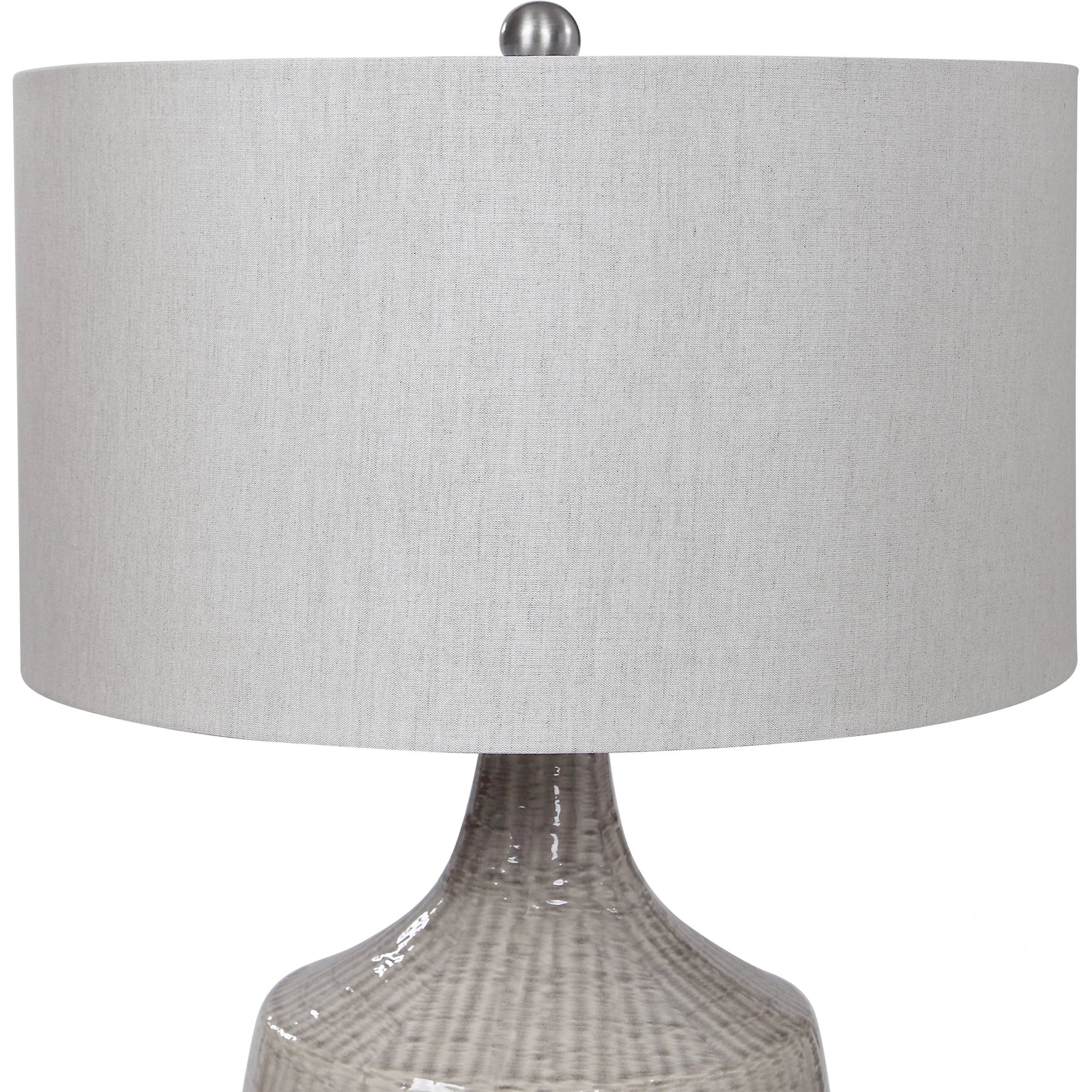 Felipe Table Lamp by Uttermost in light gray. Made from ceramic, iron, fabric in a eclectic & global style.