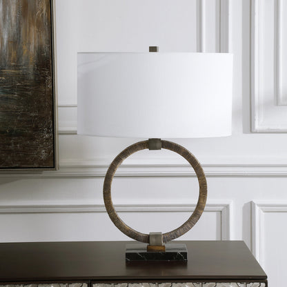 Relic Aged Table Lamp by Uttermost in gold. Made from resin, marble, iron, fabric in a eclectic & global style.