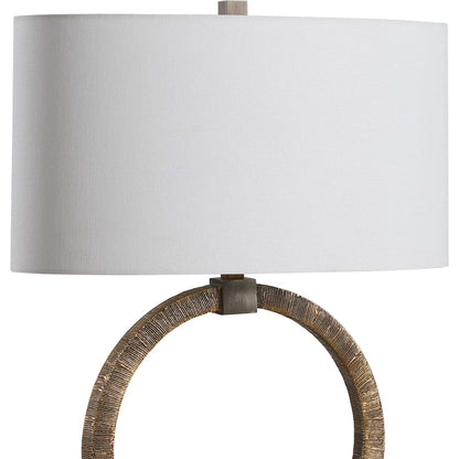 Relic Aged Table Lamp by Uttermost in gold. Made from resin, marble, iron, fabric in a eclectic & global style.