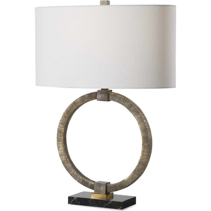 Relic Aged Table Lamp by Uttermost in gold. Made from resin, marble, iron, fabric in a eclectic & global style.