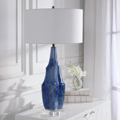 Everard Table Lamp by Uttermost in blue. Made from porcelain, crystal, iron, fabric in a modern style.
