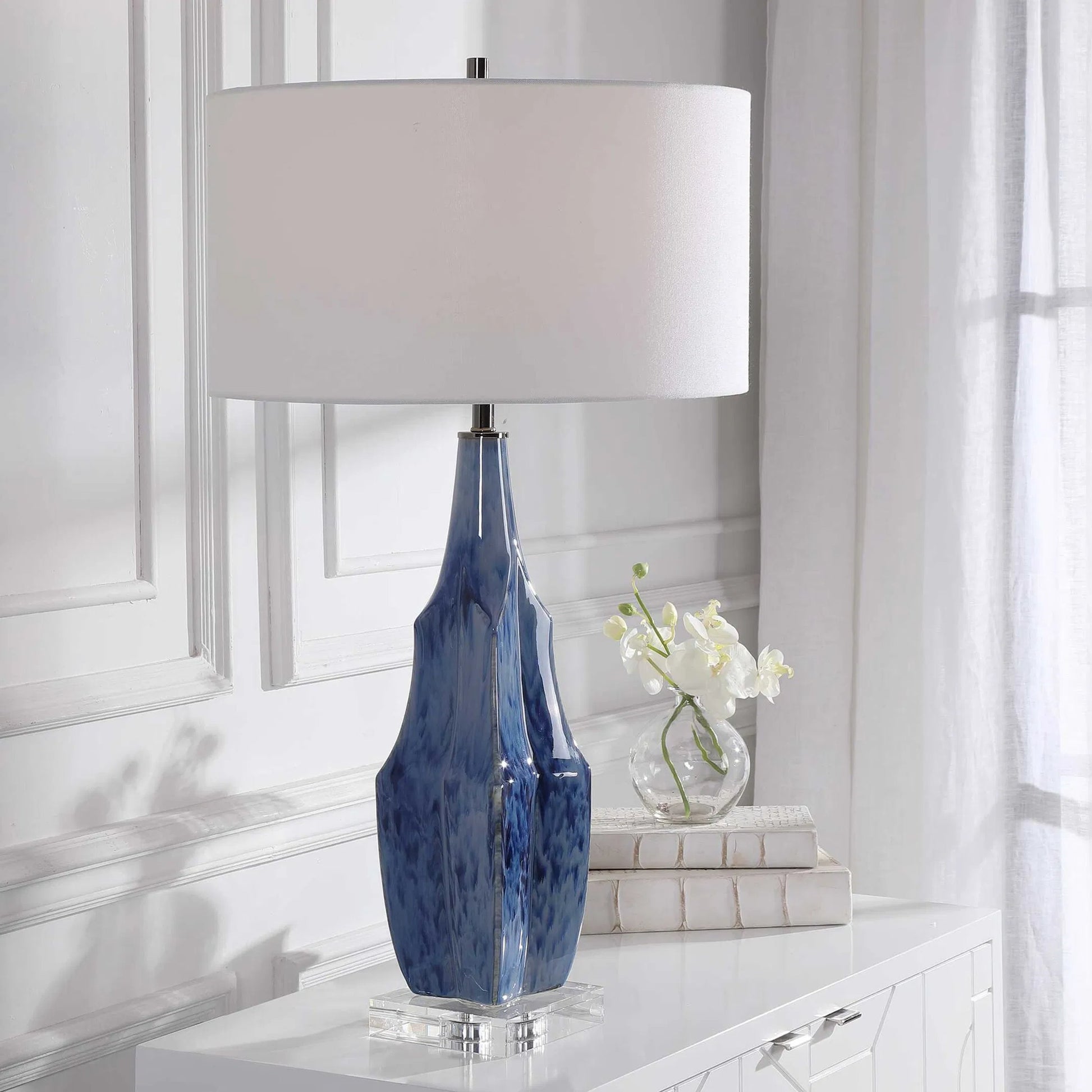 Everard Table Lamp by Uttermost in blue. Made from porcelain, crystal, iron, fabric in a modern style.