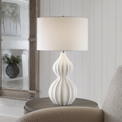 Antoinette Table Lamp by Uttermost in ivory. Made from mad-made stone, iron, fabric in a coastal style.