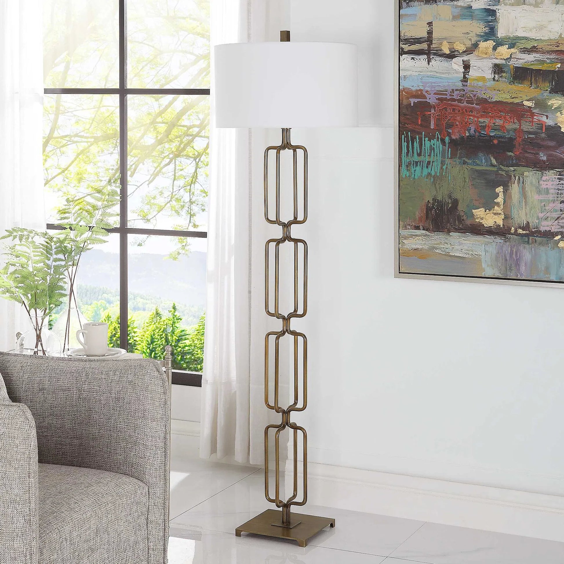 Link Floor Lamp by Uttermost in antique gold. Made from iron, fabric in a modern style.
