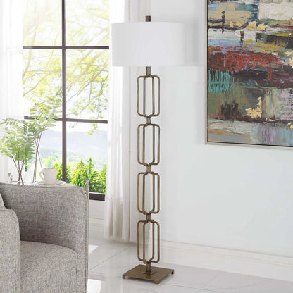 Link Floor Lamp by Uttermost in antique gold. Made from iron, fabric in a modern style.