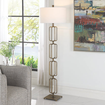 Link Floor Lamp by Uttermost in antique gold. Made from iron, fabric in a modern style.