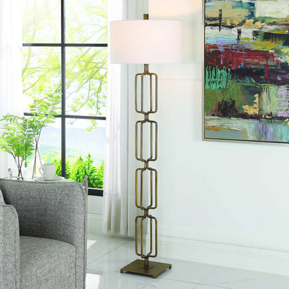 Link Floor Lamp by Uttermost in antique gold. Made from iron, fabric in a modern style.