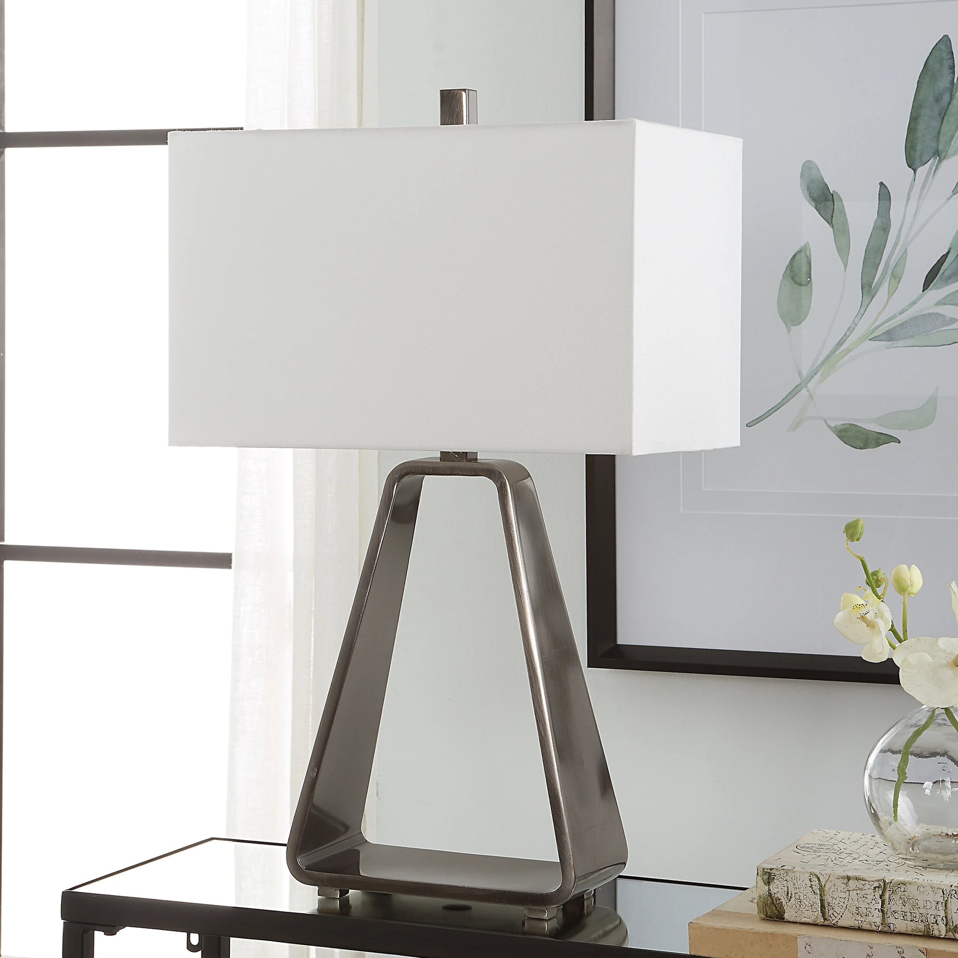 Halo Table Lamp by Uttermost in antique nickel. Made from steel, fabric in a modern style.