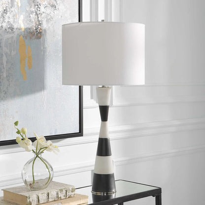 Bandeau Banded Table Lamp by Uttermost in black, white. Made from rice stone, iron, linen, resin in a modern style.