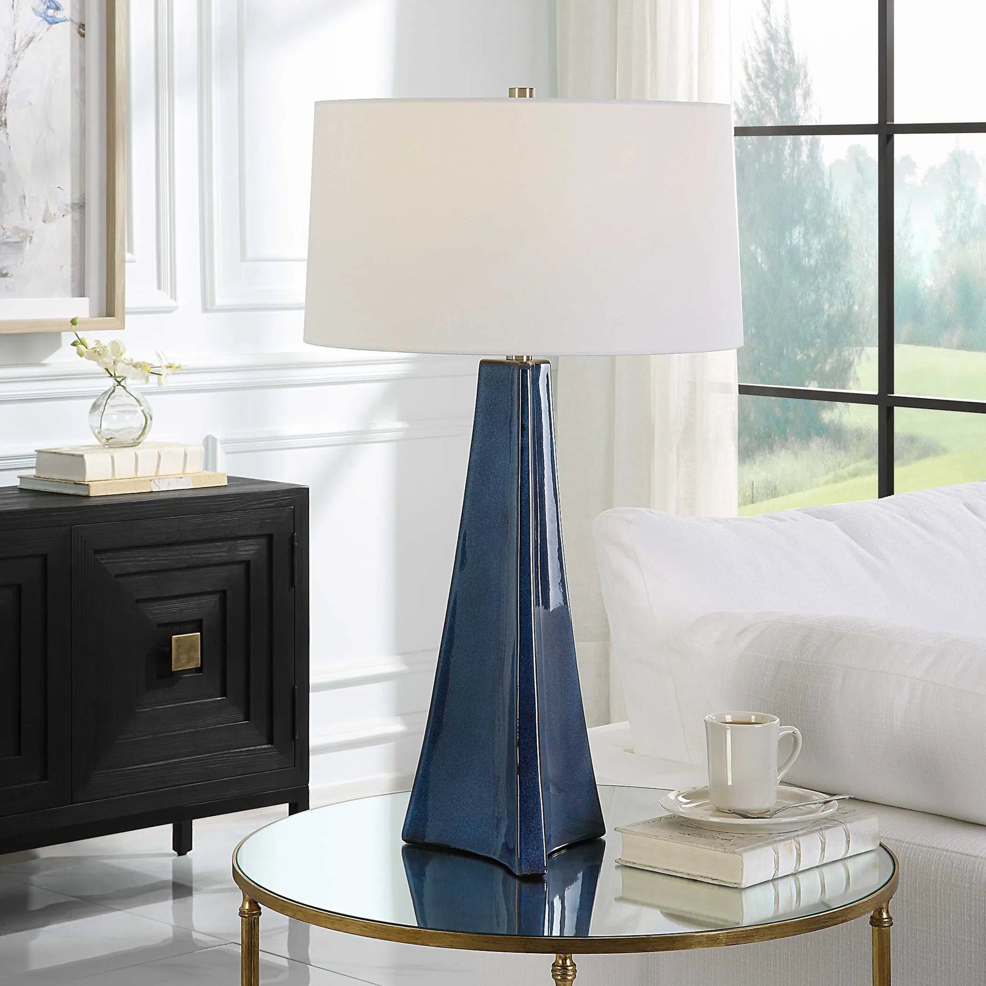 Teramo Table Lamp by Uttermost in blue and nickel. Made from ceramic, iron, fabric in a modern style.