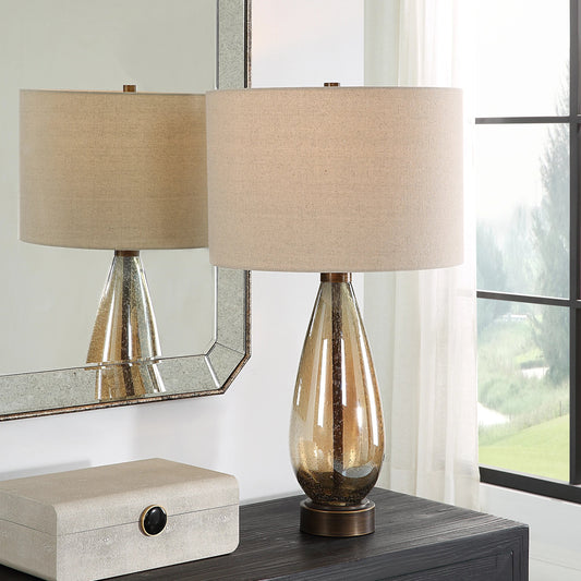 Baltic Table Lamp by Uttermost in bronze. Made from glass, iron, fabric in a modern style.