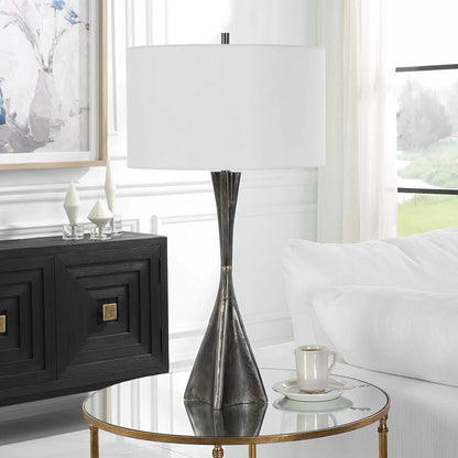 Keiron Table Lamp by Uttermost in brass. Made from steel, cast iron, fabric in a modern style.