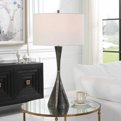 Keiron Table Lamp by Uttermost in brass. Made from steel, cast iron, fabric in a modern style.