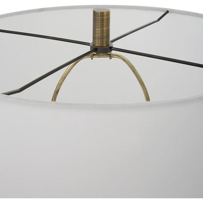 Annora Glossy Table Lamp by Uttermost in brass. Made from steel, resin, fabric in a modern style.