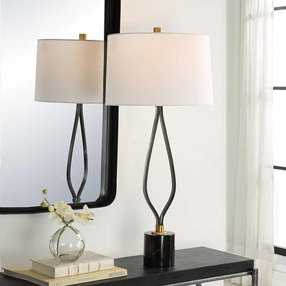 Separate Paths Table Lamp by Uttermost in black, antique brass. Made from steel, marble, fabric in a modern style.