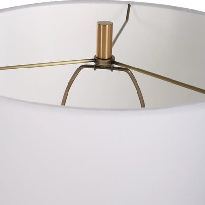 Palu Travertine Table Lamp by Uttermost in brass. Made from iron, travertine, linen in a modern style.