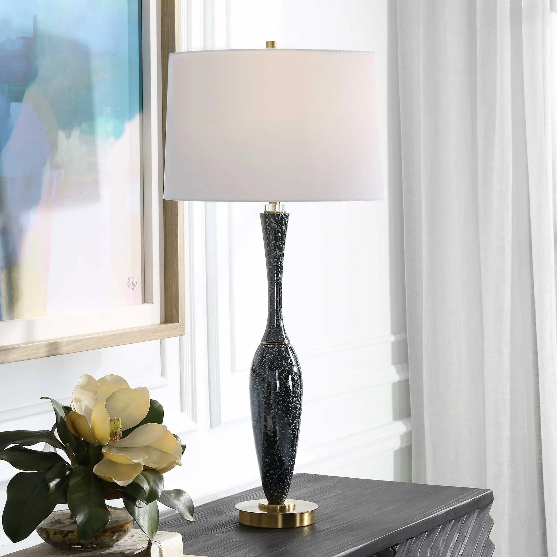 Remy Table Lamp by Uttermost in dark navy. Made from ceramic, iron, fabric, acrylic in a eclectic & global style.