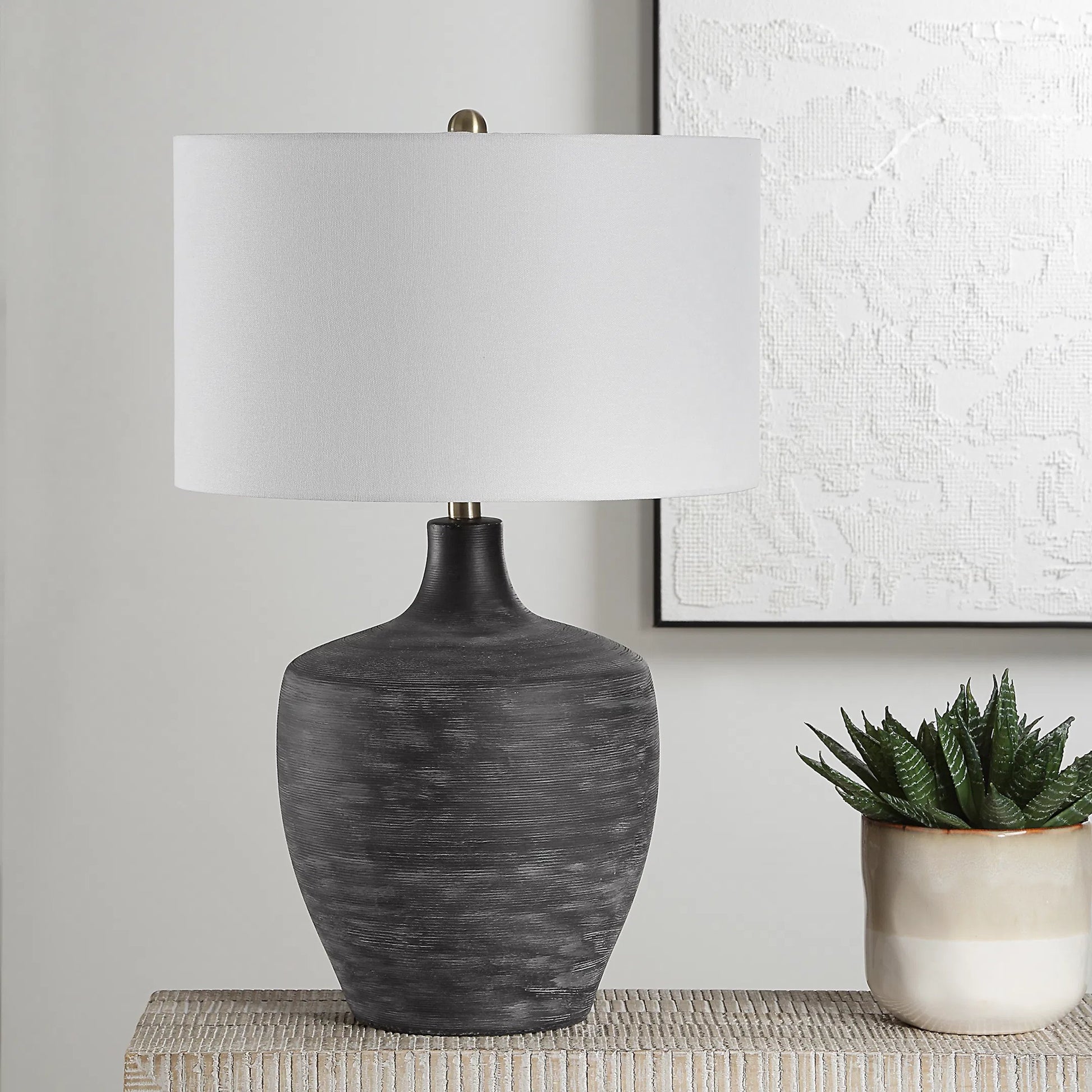 Graphite Ribbed Table Lamp by Uttermost in brass. Made from ceramic, fabric, metal in a unique style.