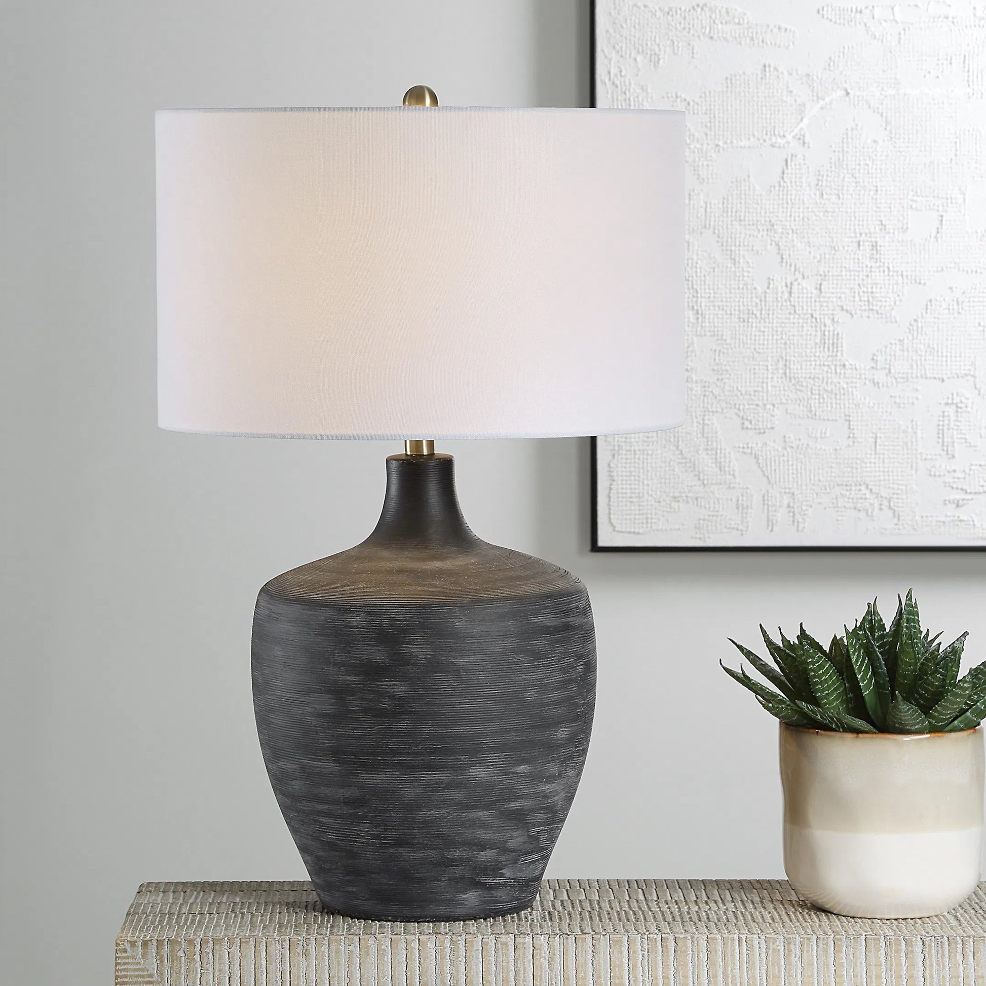 Graphite Ribbed Table Lamp by Uttermost in brass. Made from ceramic, fabric, metal in a unique style.