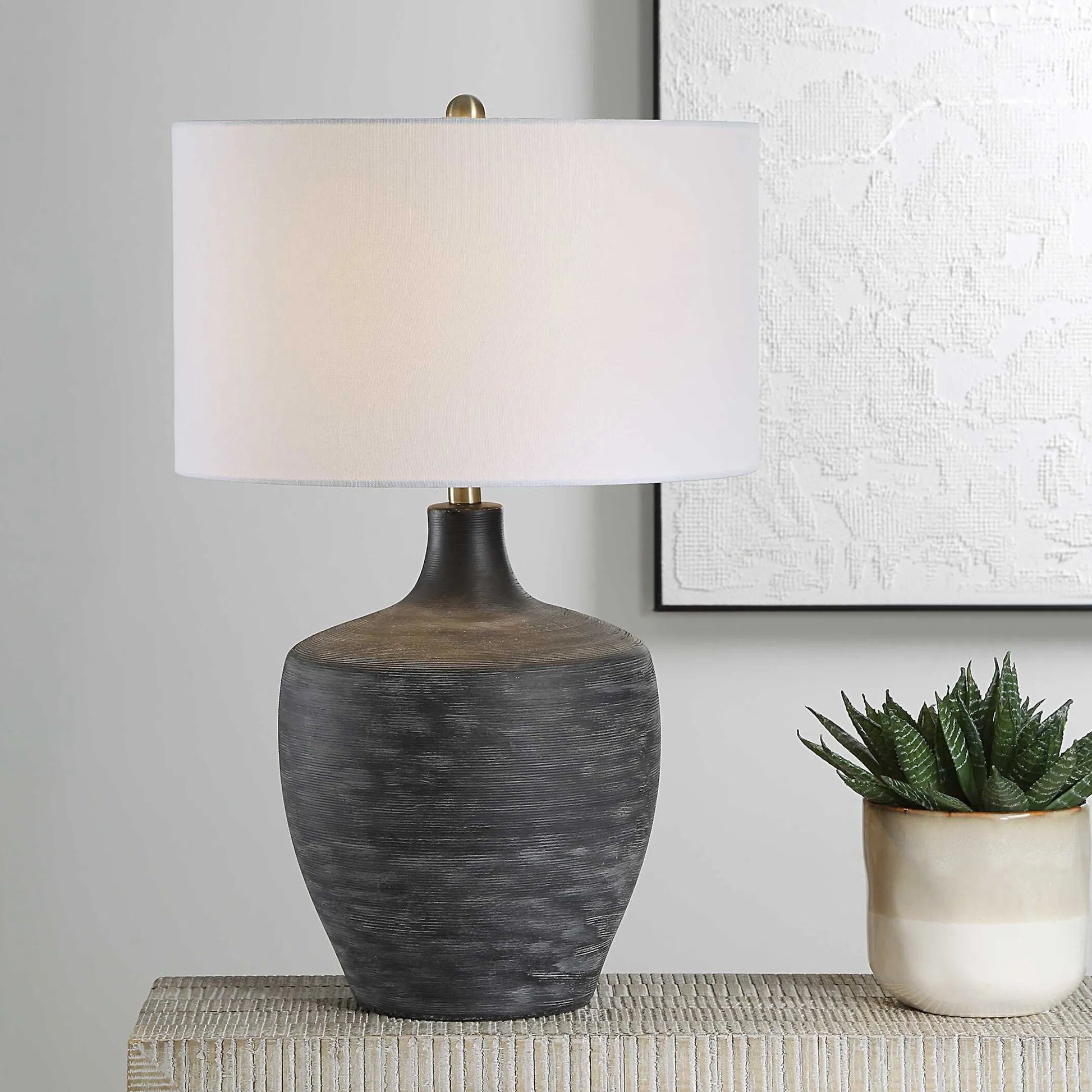 Graphite Ribbed Table Lamp by Uttermost in brass. Made from ceramic, fabric, metal in a unique style.