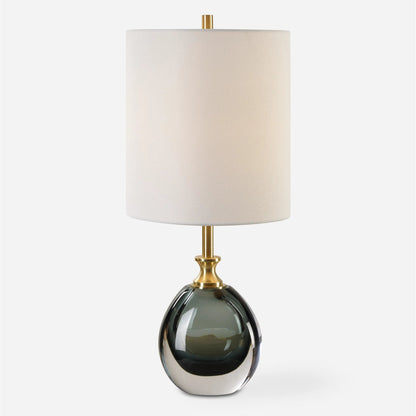 Enigma Glass Buffet Lamp by Uttermost in brass. Made from colored glaze glass, metal, fabric in a eclectic & global style.
