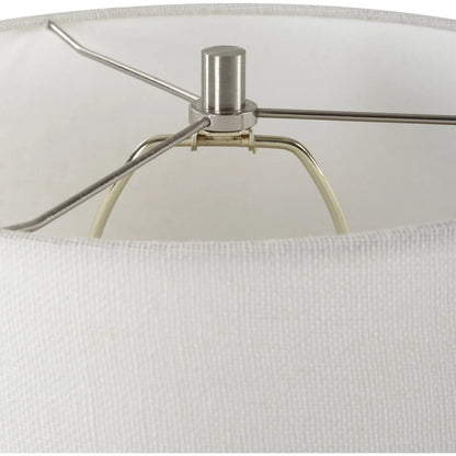 Rupture Table Lamp by Uttermost in nickel. Made from steel, ceramic, fabric in a modern style.
