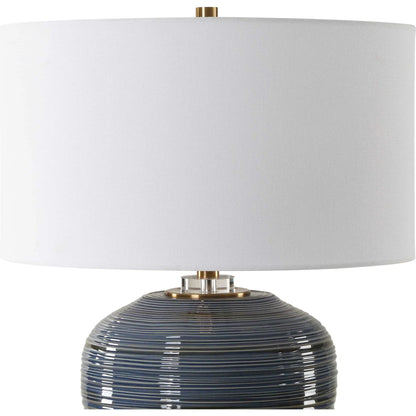 Moher Glossy Table Lamp by Uttermost in brass. Made from ceramic, crystal, iron, fabric in a eclectic & global style.
