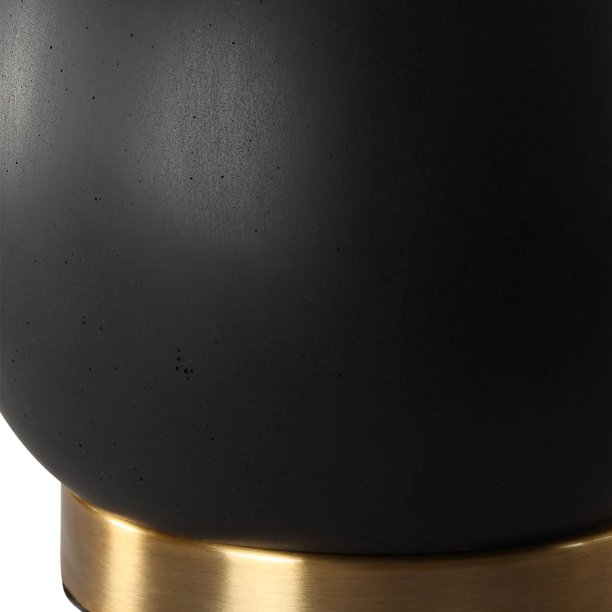 Nocturnal Table Lamp by Uttermost in brass. Made from mad-made stone, iron, fabric in a modern style.