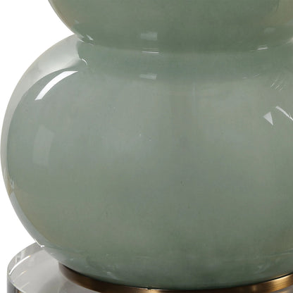 Sanctuary Table Lamp by Uttermost in brass. Made from iron, crystal, fabric, glass in a modern style.