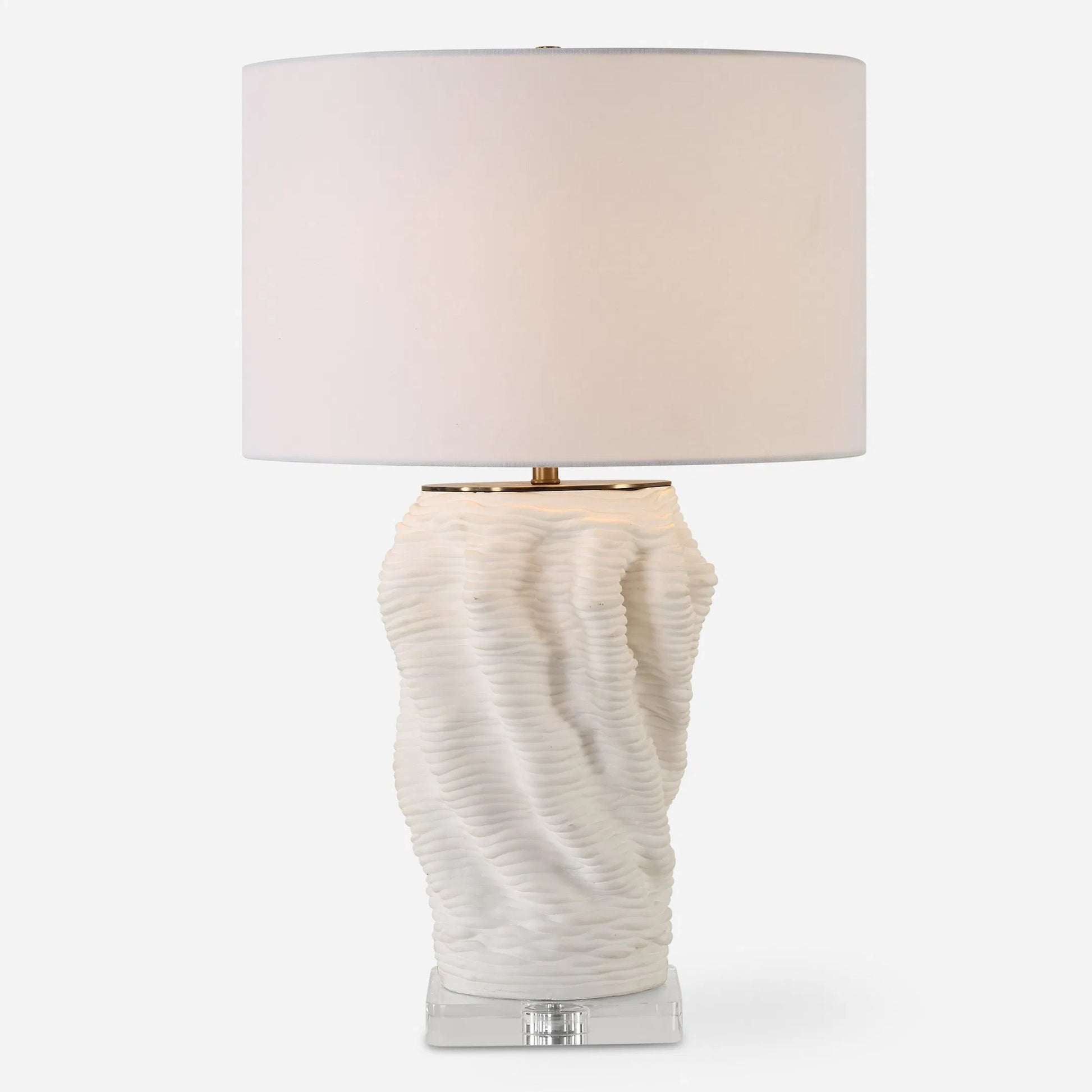 Stratified Table Lamp by Uttermost in brass. Made from ceramic, crystal, steel, fabric in a modern style.