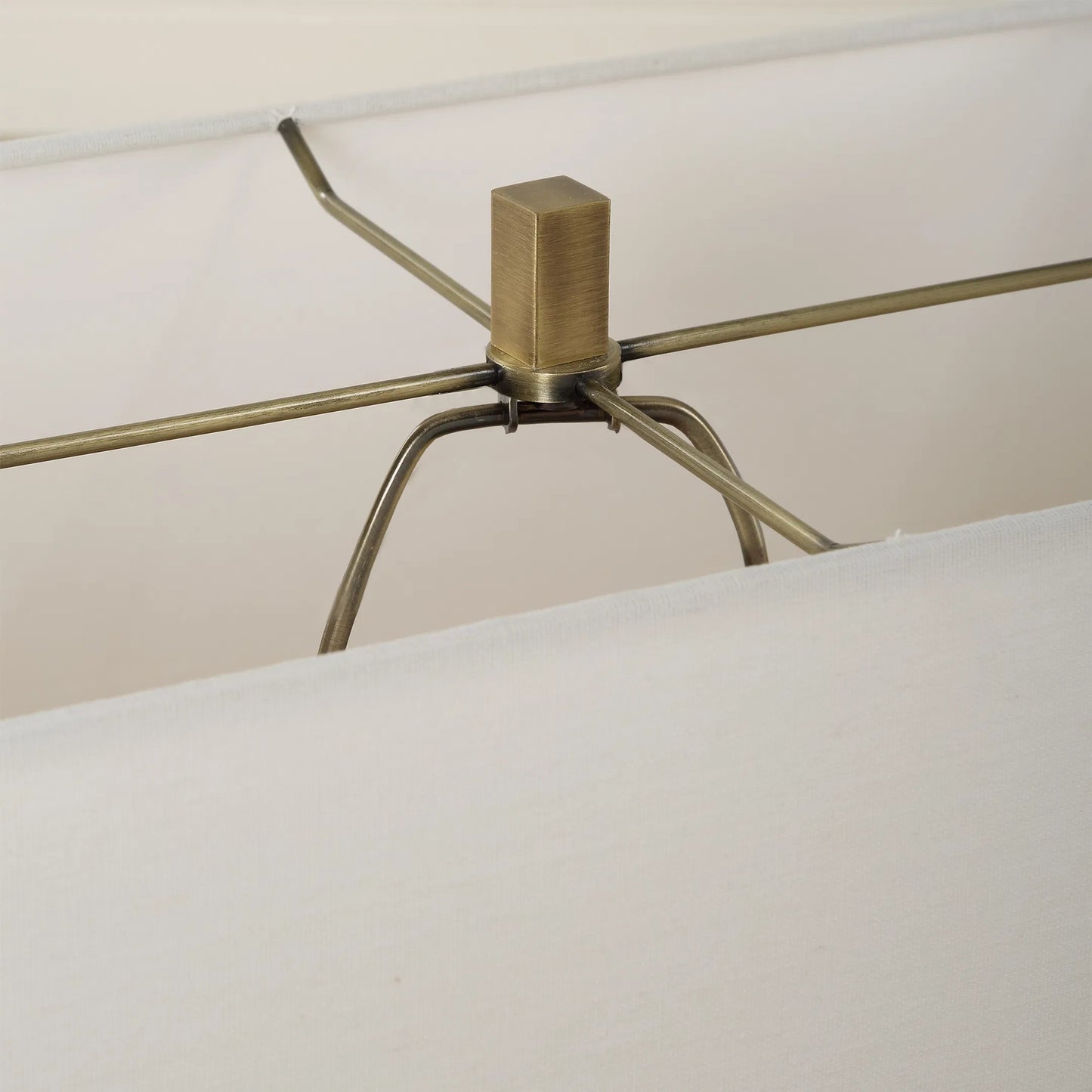 004 SI-2262435 | Closeup | Turning Point Travertine Table Lamp by Uttermost in brass. Made from iron, travertine, fabric in a transitional style.