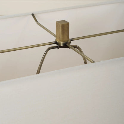 Turning Point Travertine Table Lamp by Uttermost in brass. Made from iron, travertine, fabric in a transitional style.