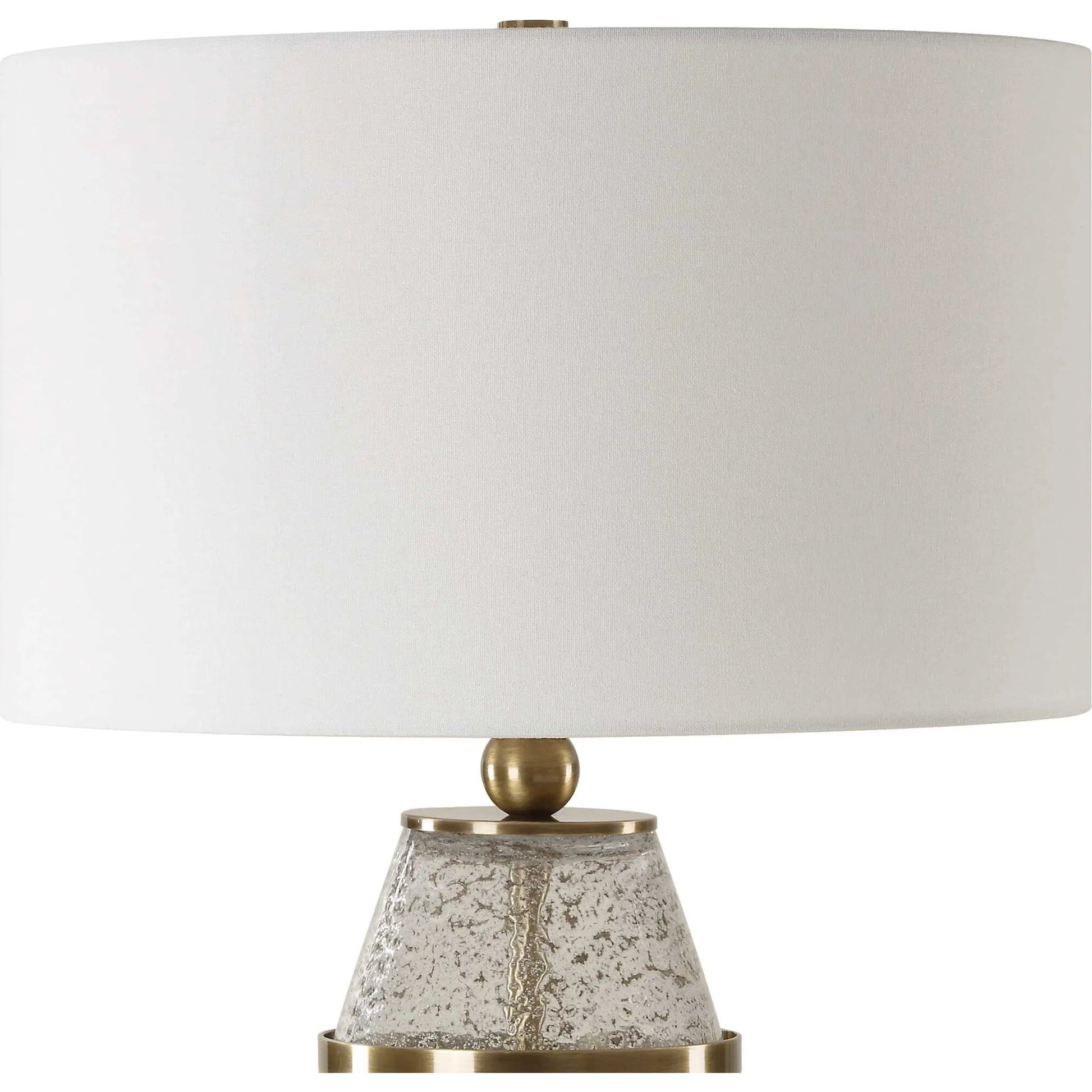 Out of Time Seeded Glass Table Lamp by Uttermost in brass. Made from iron, glass, fabric in a modern style.