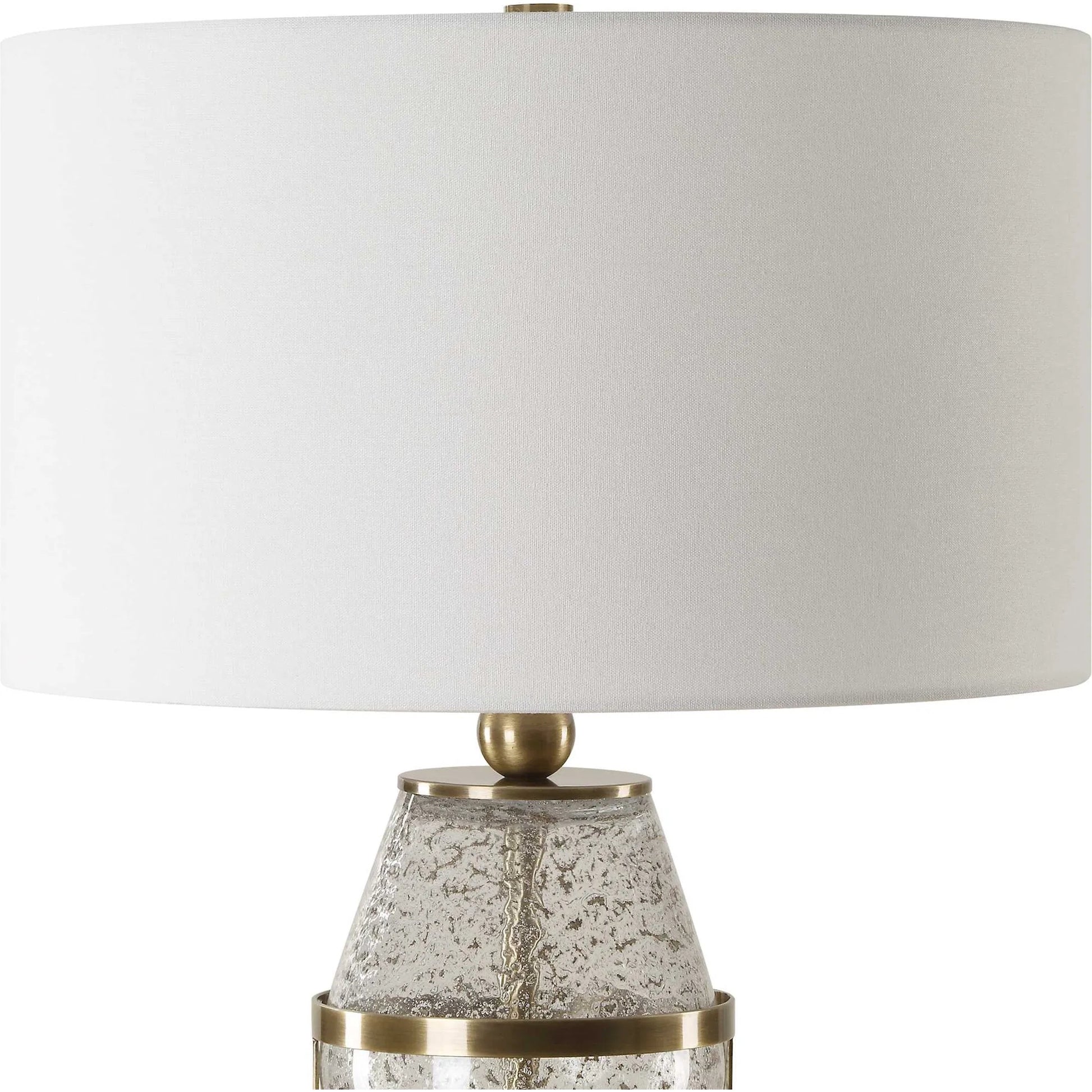 Out of Time Seeded Glass Table Lamp by Uttermost in brass. Made from iron, glass, fabric in a modern style.
