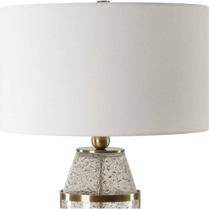 Out of Time Seeded Glass Table Lamp by Uttermost in brass. Made from iron, glass, fabric in a modern style.