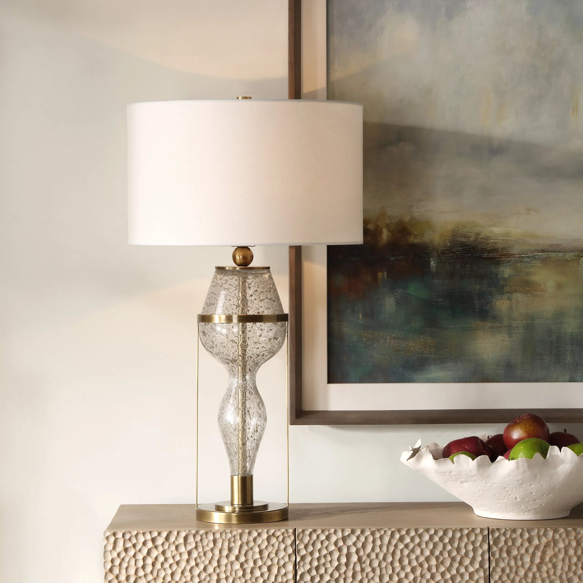 Out of Time Seeded Glass Table Lamp by Uttermost in brass. Made from iron, glass, fabric in a modern style.