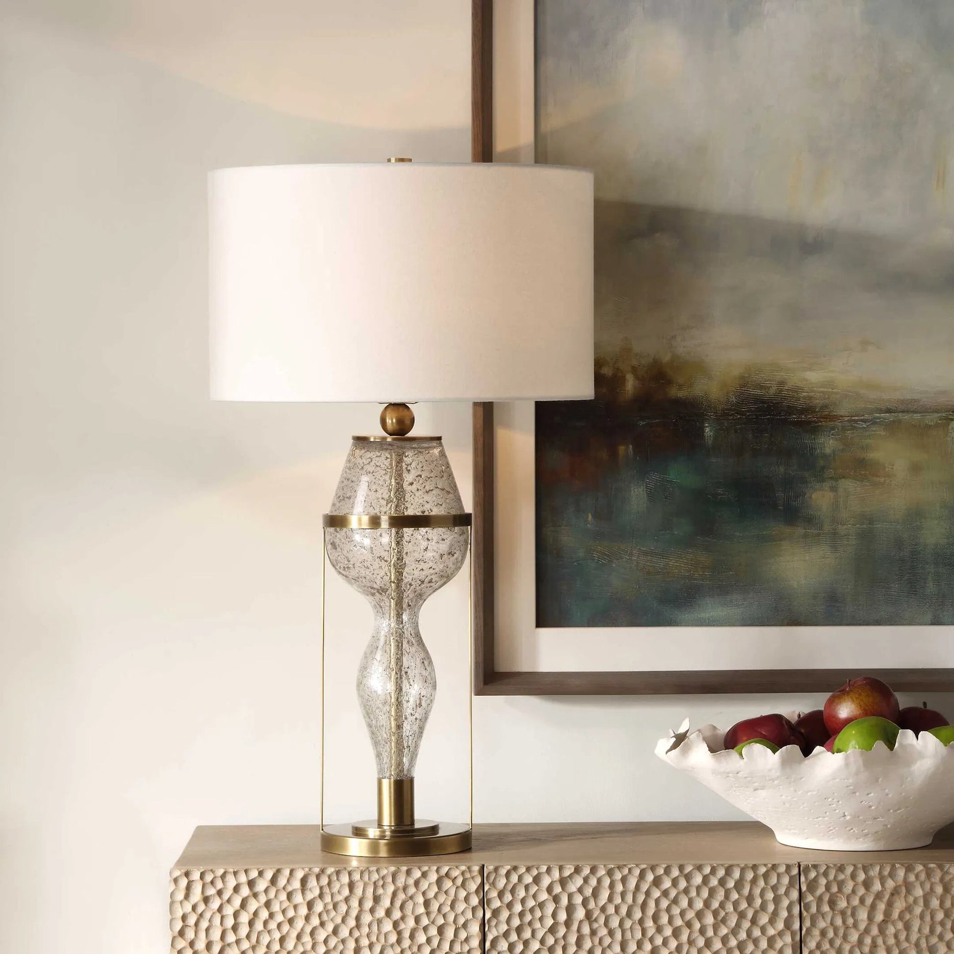 Out of Time Seeded Glass Table Lamp by Uttermost in brass. Made from iron, glass, fabric in a modern style.